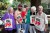 Sheehan/Gaumer/Berrigan family modeling tote bags at the 90th Anniversary Conference